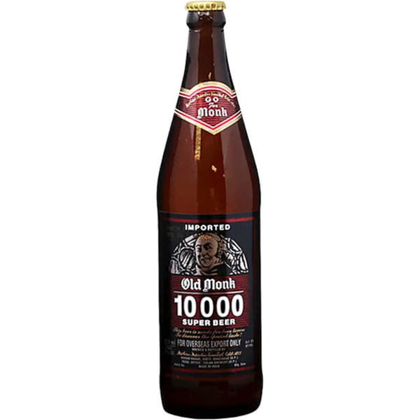 A brown bottle of Old Monk 10000 Super Beer, an imported Indian beer, on a white background.